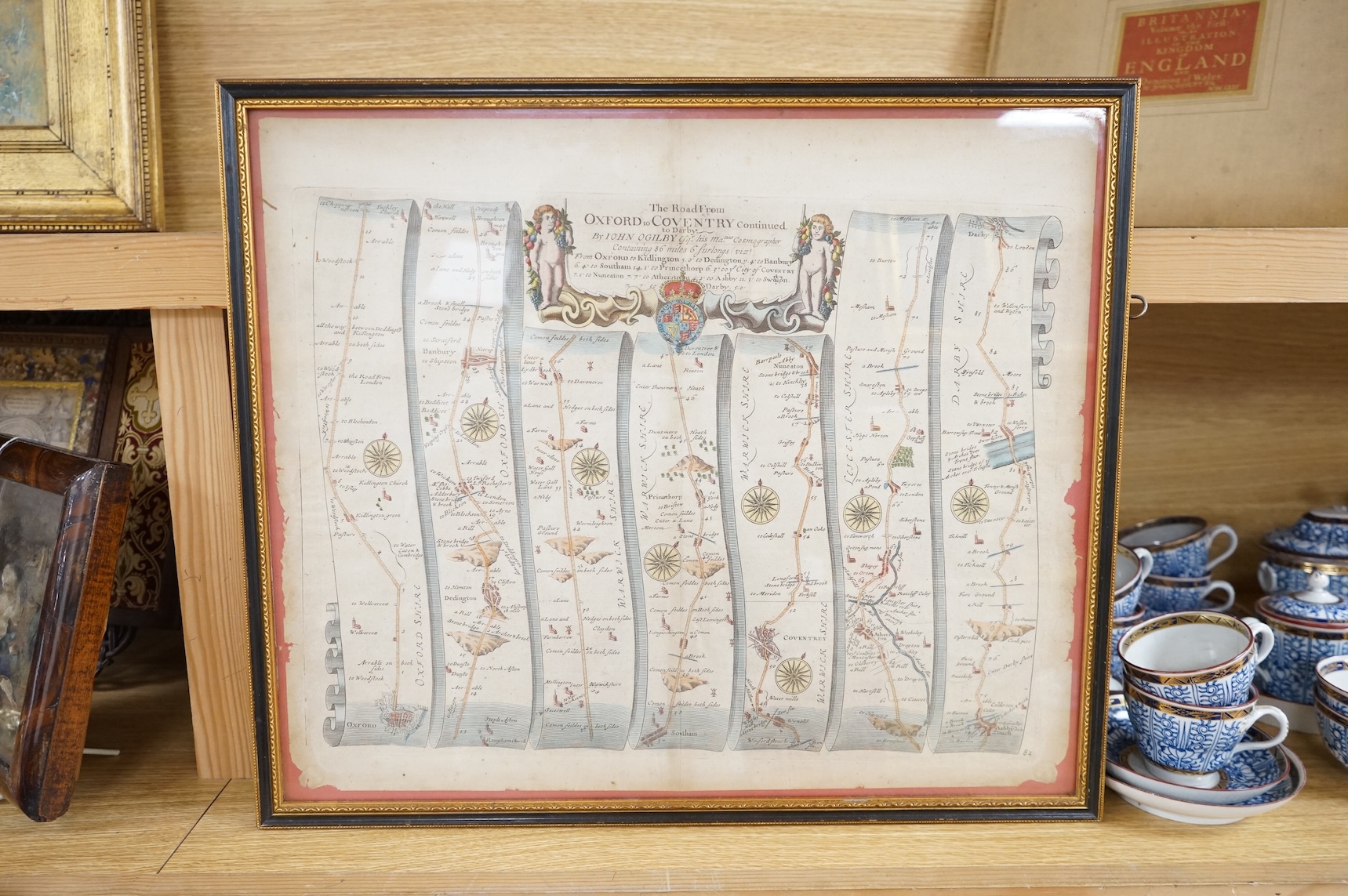 John Ogilby (1600-1676), hand coloured engraved road map, ‘Oxford to Coventry’ together with Britannia, volume the first or an illustration of the Kingdom of England and Dominion of Wales' by John Obilby, hardback book,